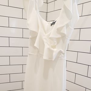 White fitted dress with ruffle neckline